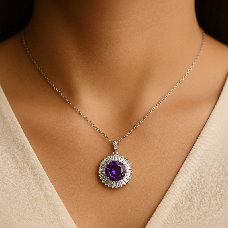 Necklace with a purple gemstone pendant on a model wearing a beige top.